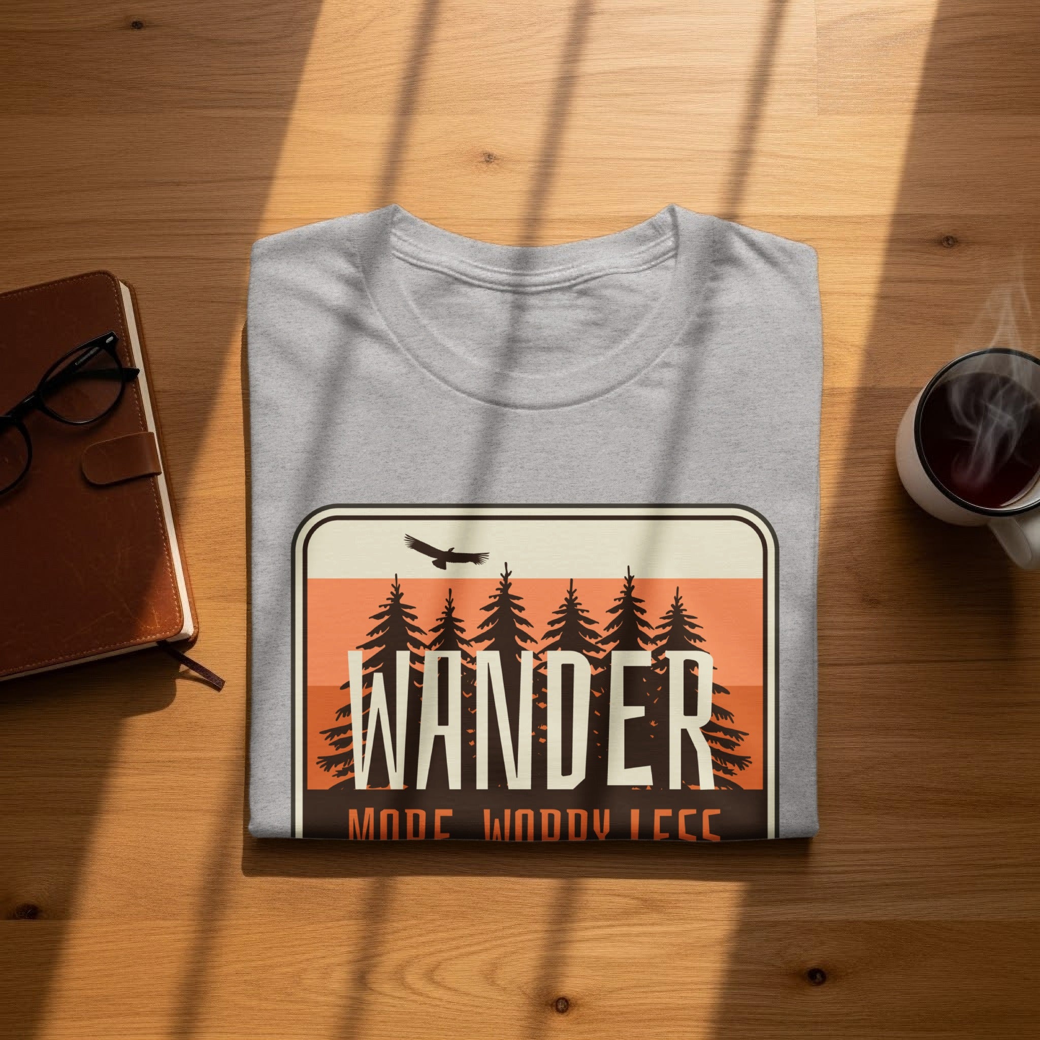 Grey t-shirt with "Wander Mode Wnoddy Less" graphic featuring trees and a bird.