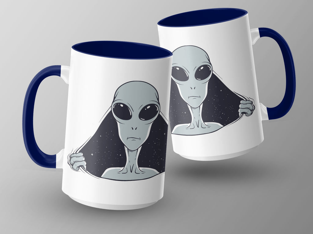 Two white mugs with blue handles featuring a grey alien peeking through starry space.