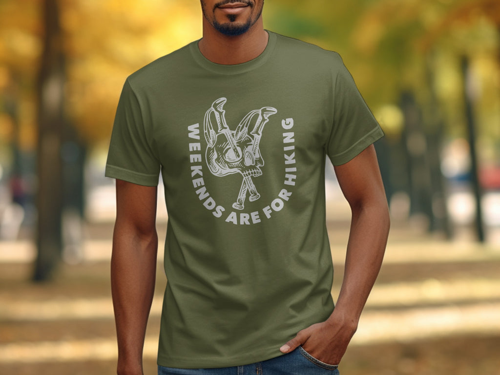 Green t-shirt with white graphic of crossed hiking poles and skull. "Weekends are for Hiking" text.