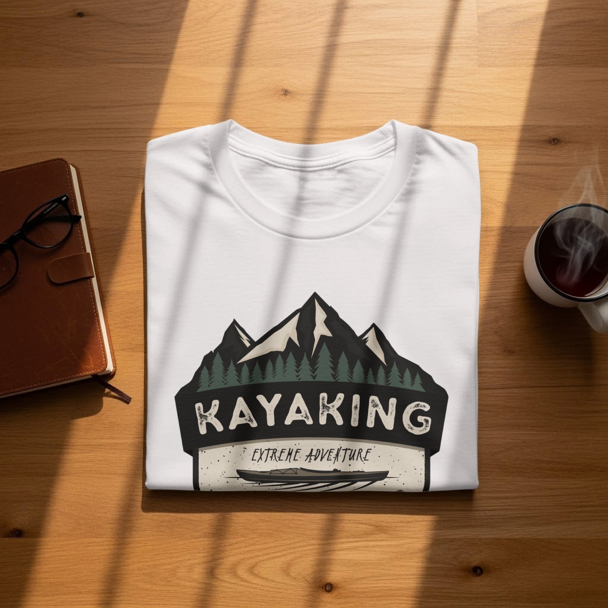 White t-shirt with "Kayaking Extreme Adventure" graphic featuring mountains and kayak.