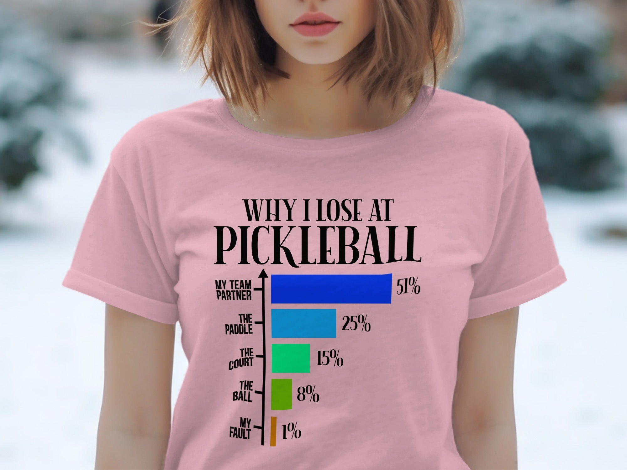 Pink t-shirt with "Why I Lose at Pickleball" and a bar chart showing reasons.