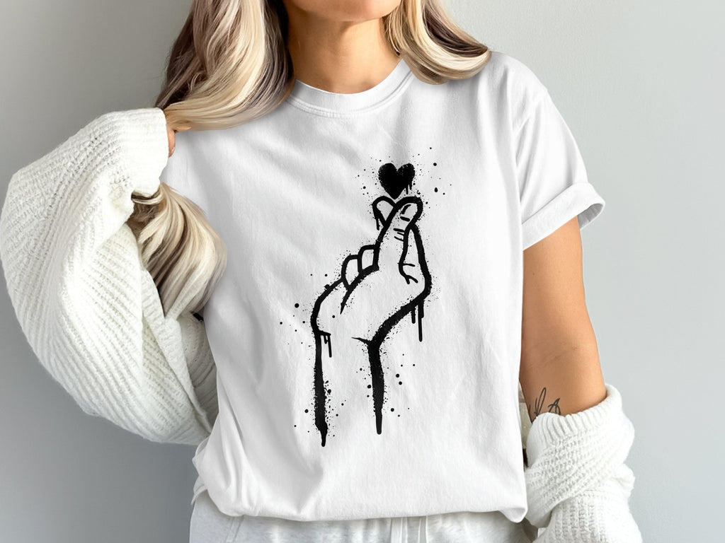 White t-shirt with a black graffiti-style hand making a heart gesture.
