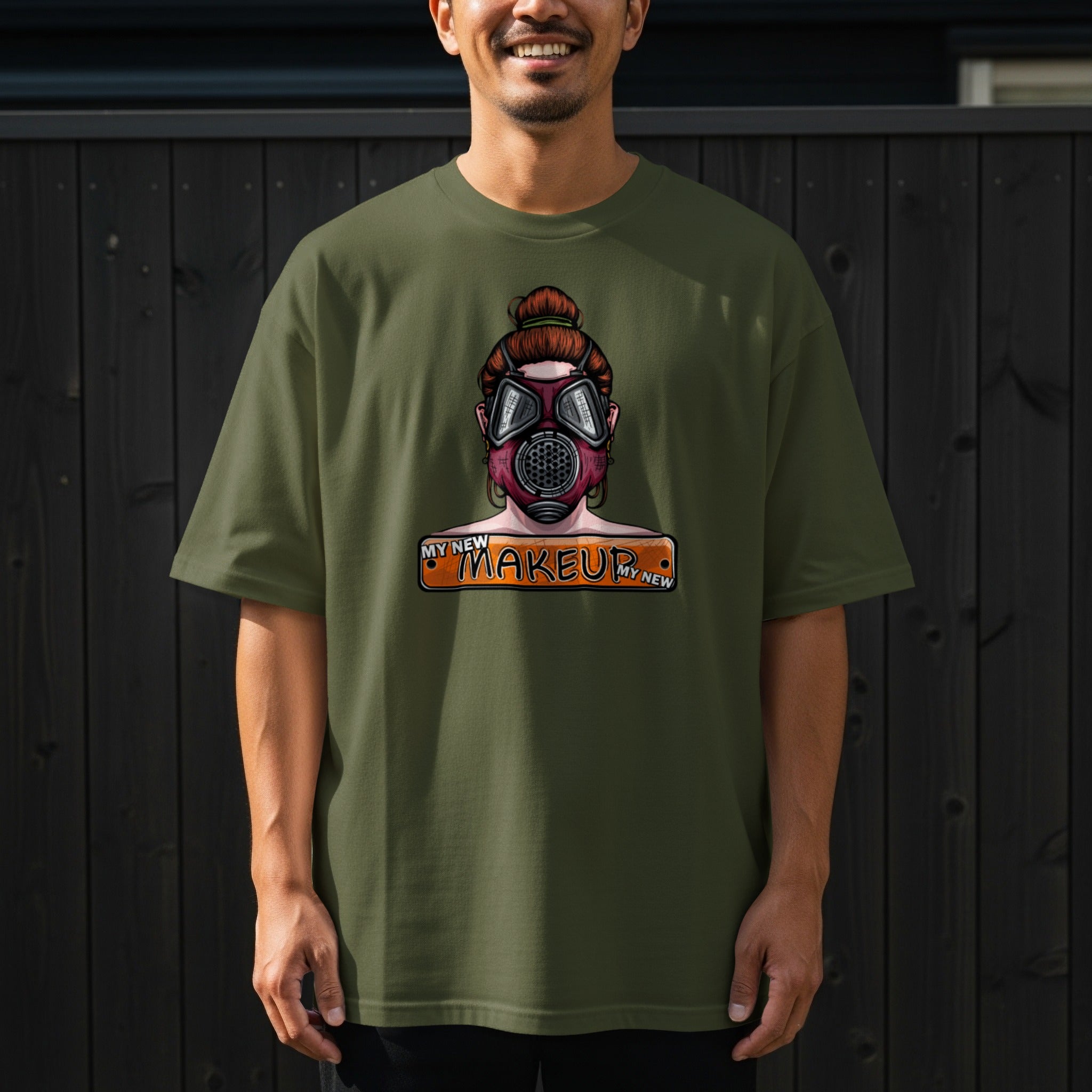 Green t-shirt with a graphic of a person in a gas mask and the words "MY NEW MAKEUP".