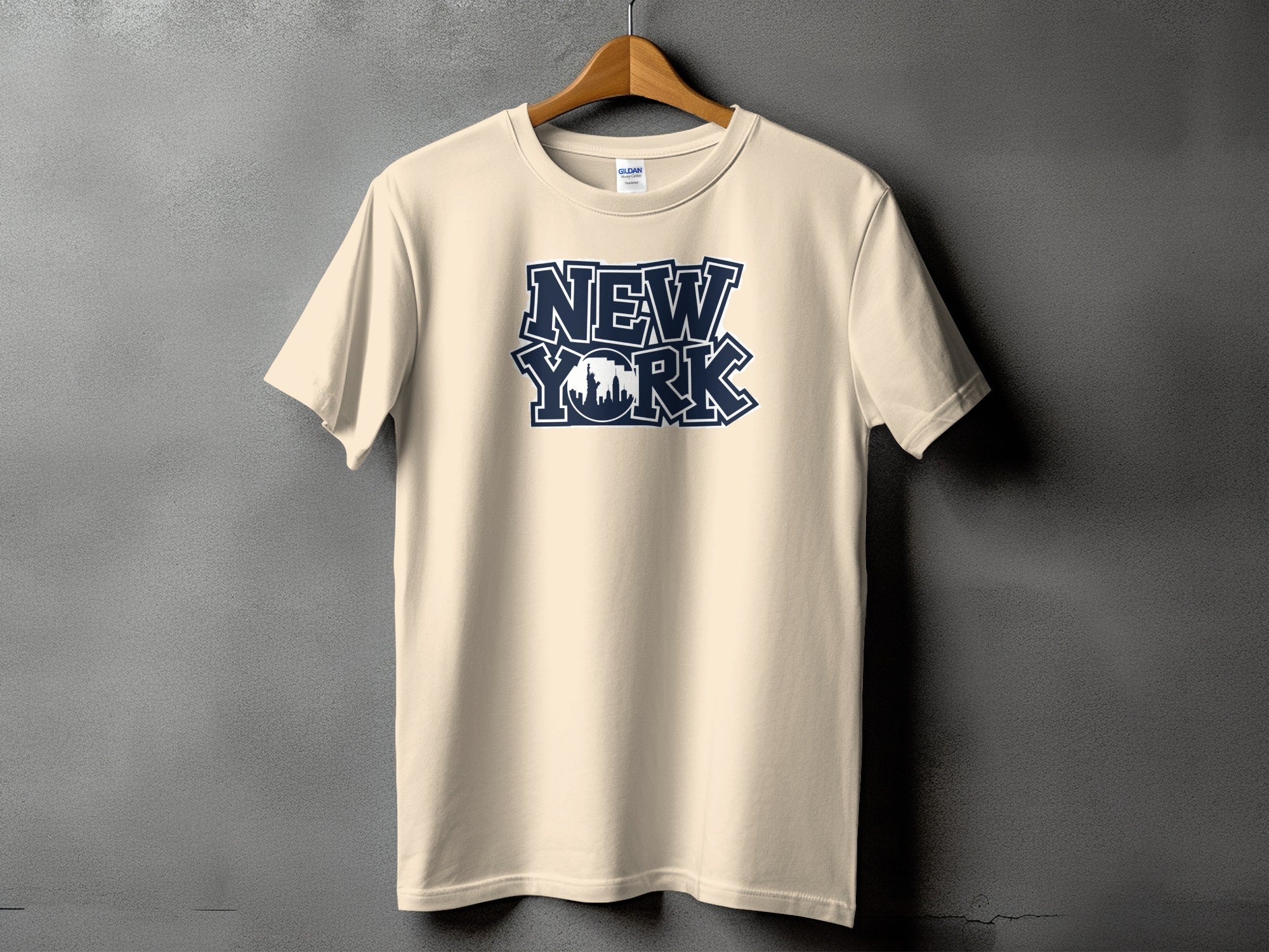 Light cream t-shirt with navy "New York" text and skyline graphic.