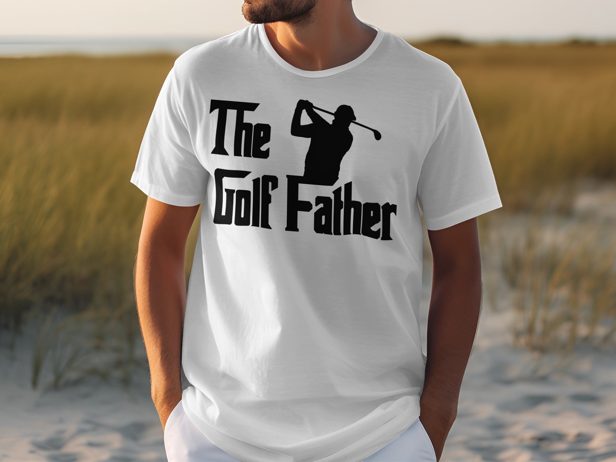 White t-shirt with black text "The Golf Father" and golfer silhouette.