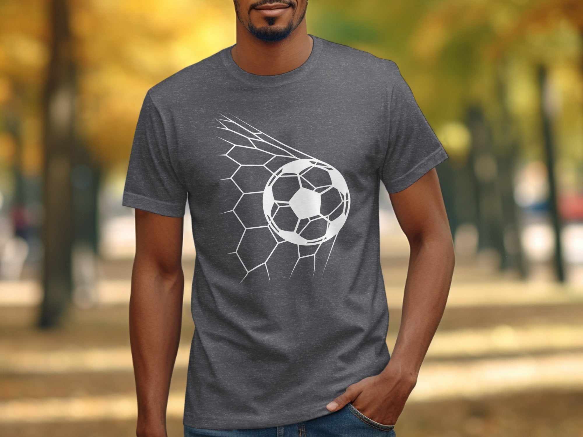 Man wearing a grey t-shirt with a white soccer ball in a net graphic.