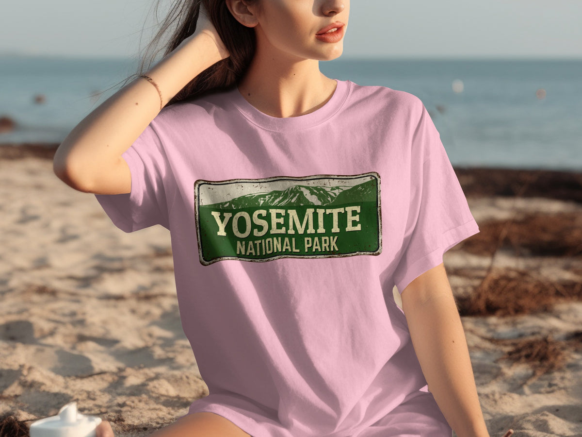 Pink t-shirt with "Yosemite National Park" text and mountain graphic.