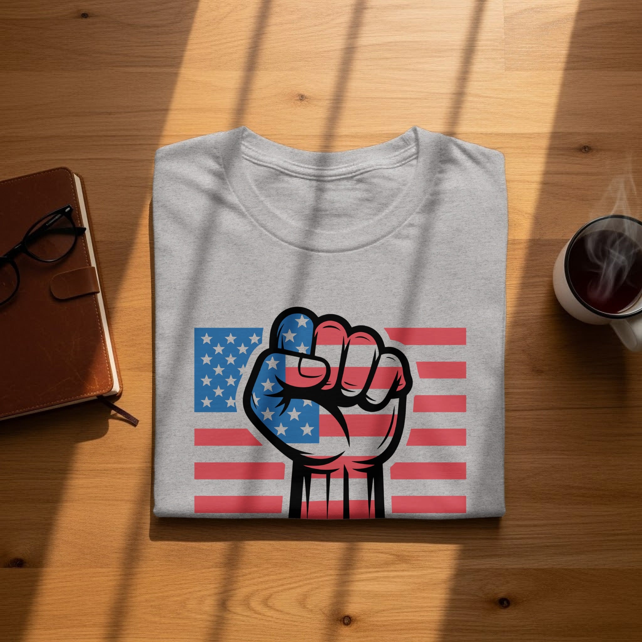 Grey t-shirt with a raised fist graphic superimposed on the American flag.