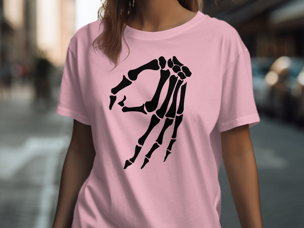 Pink t-shirt with black skeleton hand logo on the left chest.