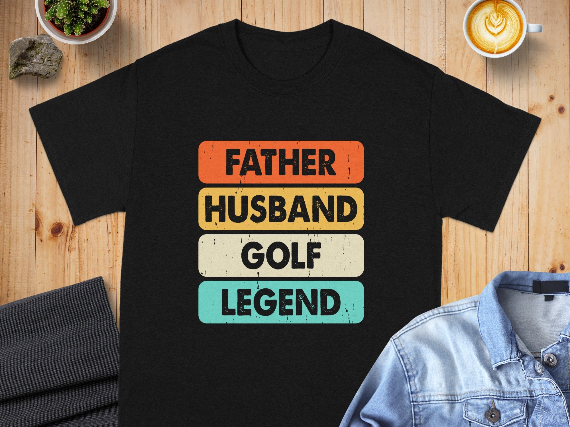 Black t-shirt with text "Father Husband Golf Legend" stacked and colored.
