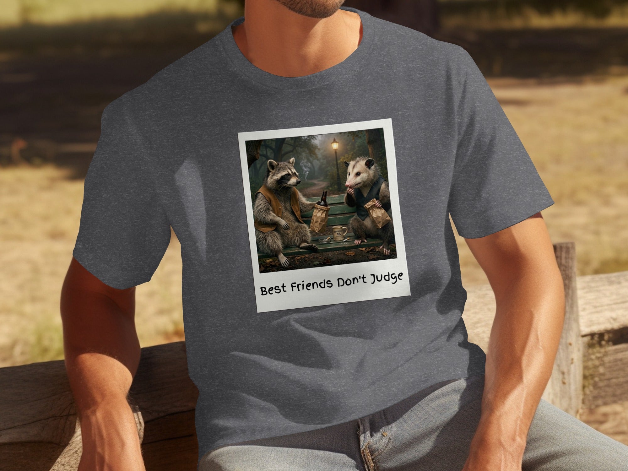 T-shirt with a polaroid graphic of a raccoon and possum on a bench.