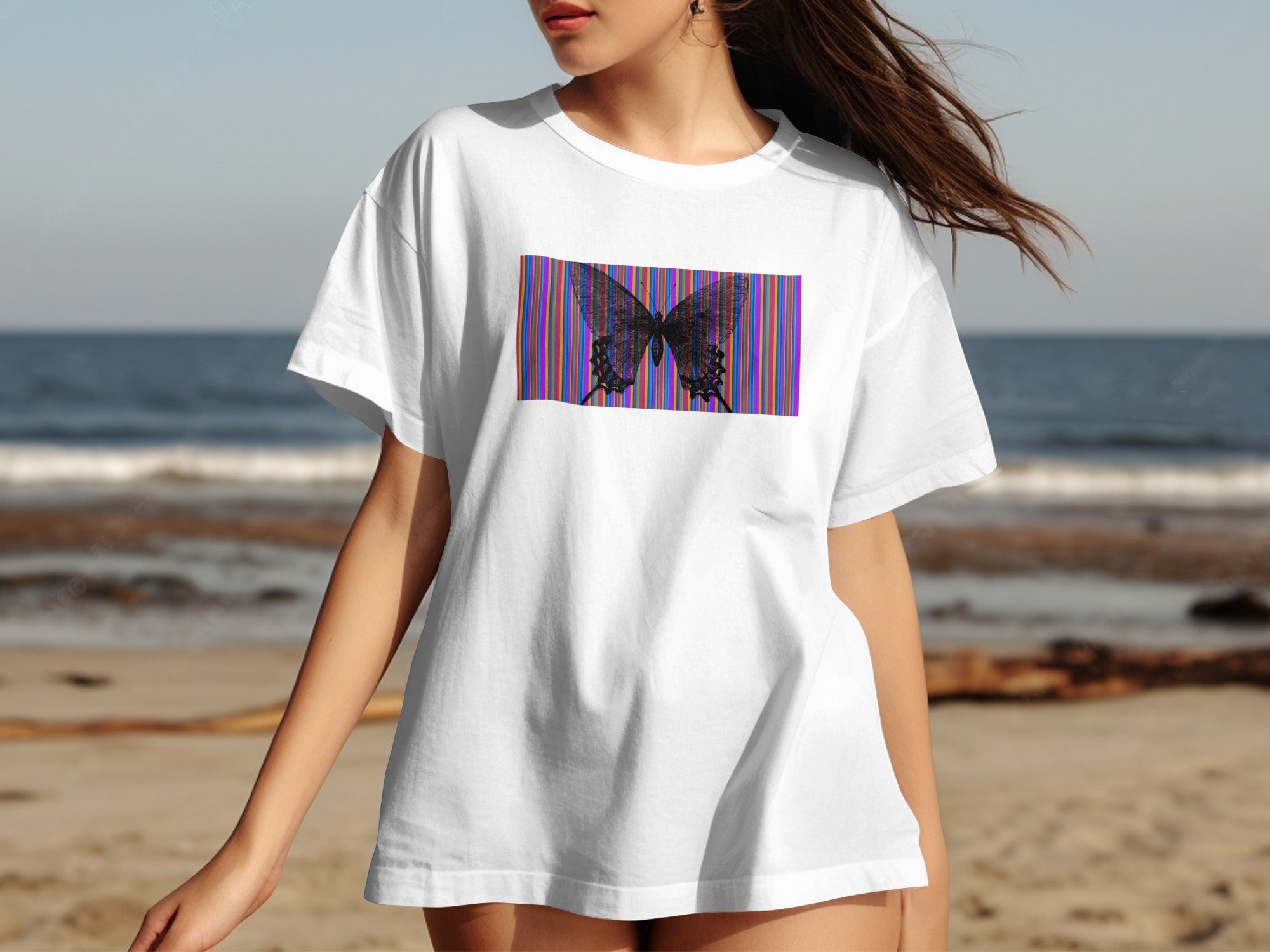 White t-shirt featuring a dark butterfly graphic against a striped background.