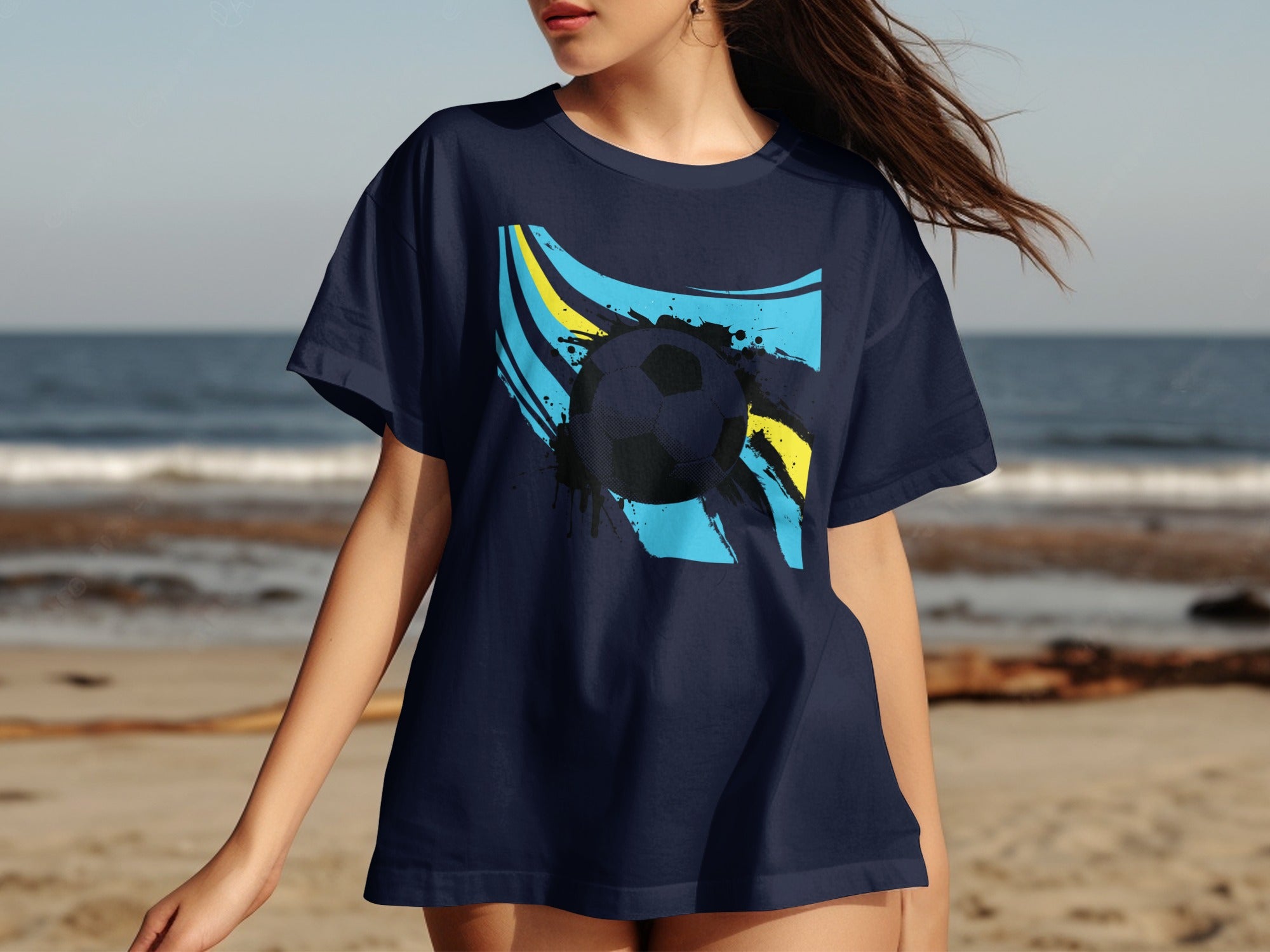 Navy t-shirt with abstract blue and yellow graphic and black soccer ball.