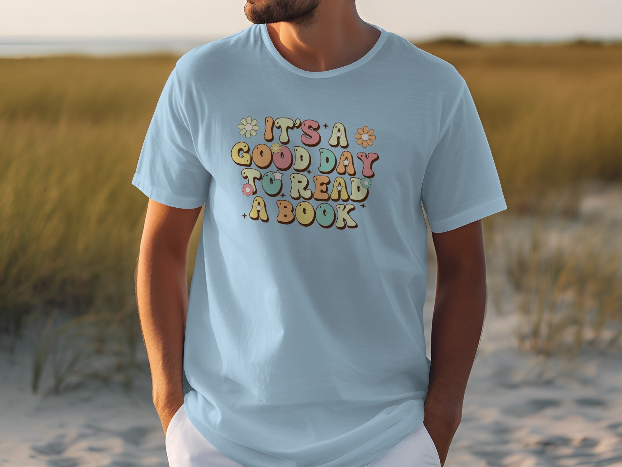 Light blue t-shirt with "It's a good day to read a book" in colorful retro lettering