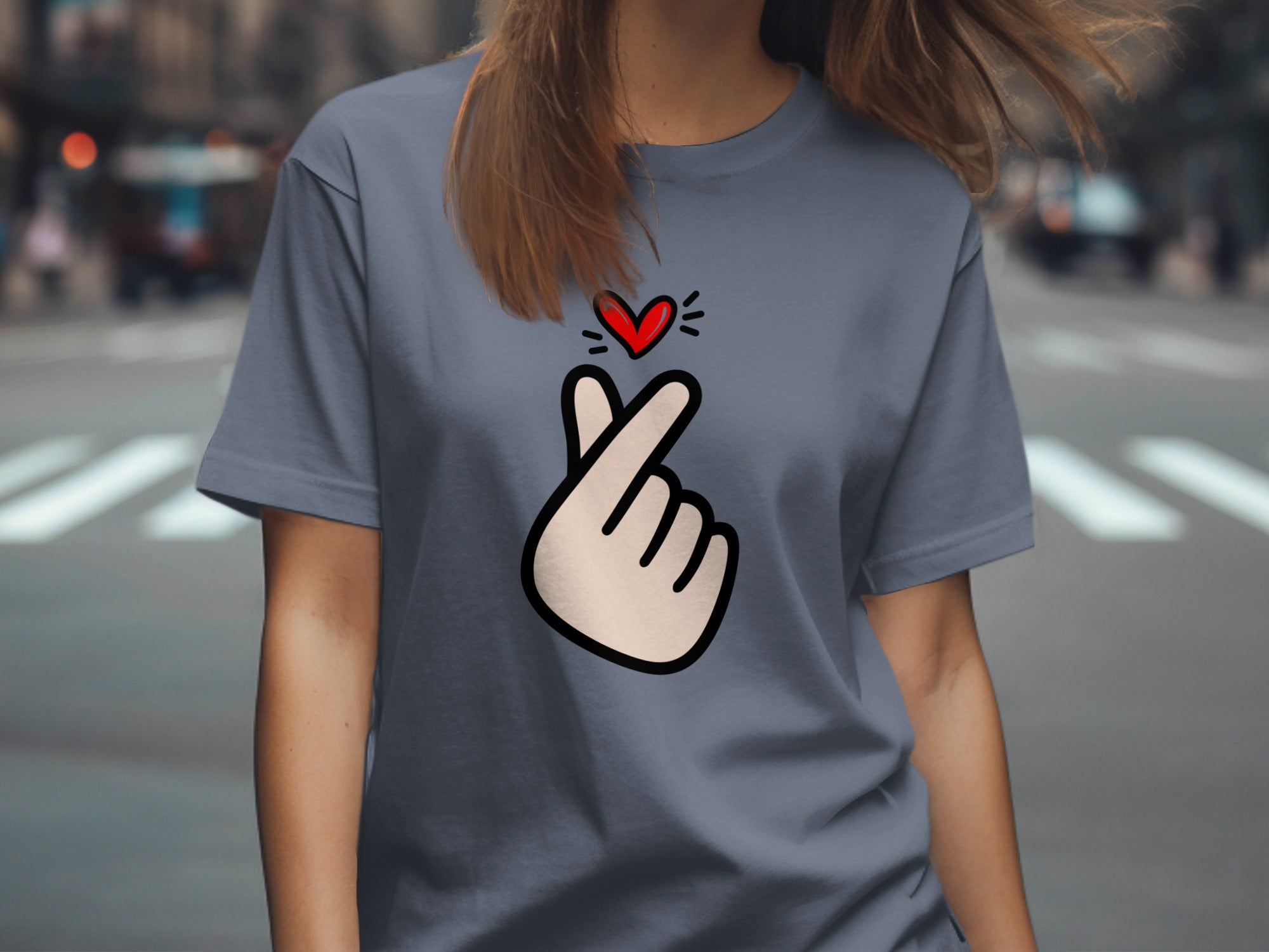 Gray t-shirt with a cartoon hand forming a finger heart and red heart.