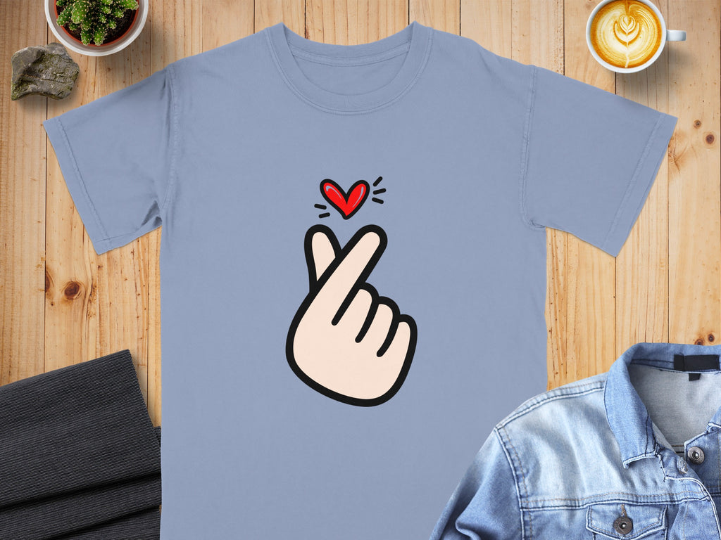Light blue t-shirt with a cartoon finger heart graphic and red heart.