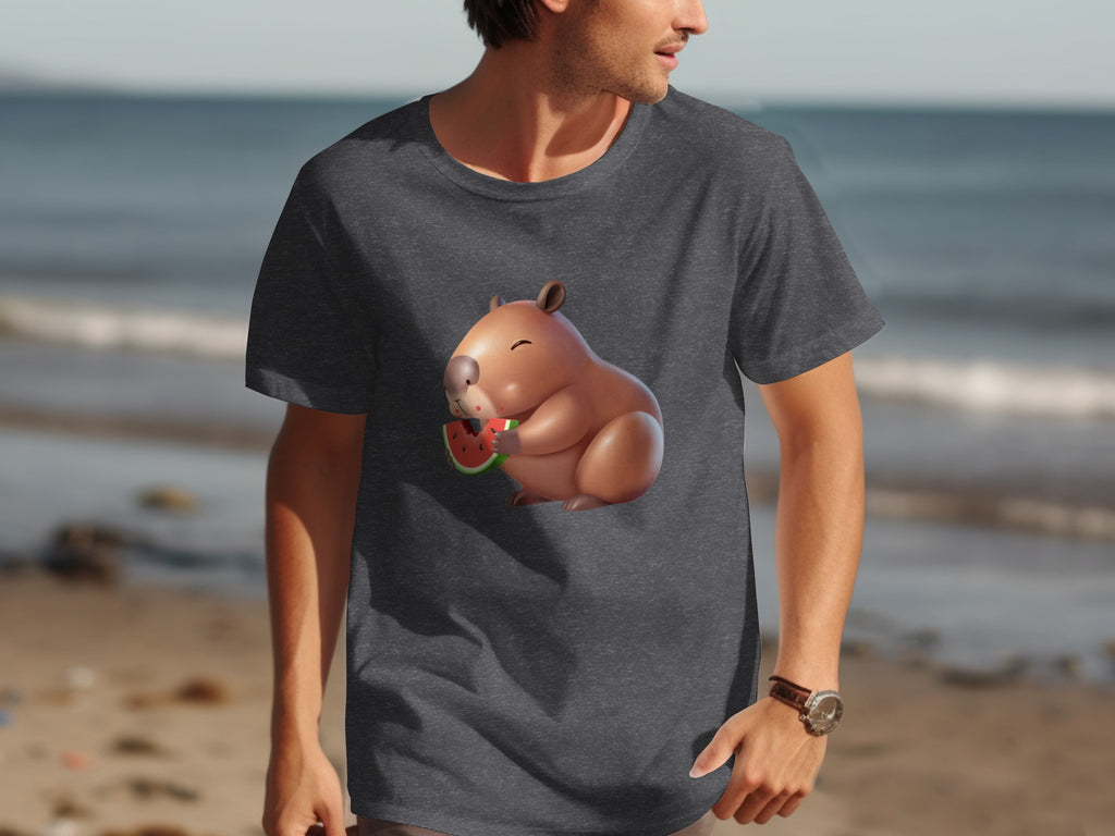Capybara eating watermelon graphic on a dark gray t-shirt at the beach.