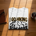 White t-shirt with "I GO HIKING BECAUSE DUNKING" text and mountain graphic.