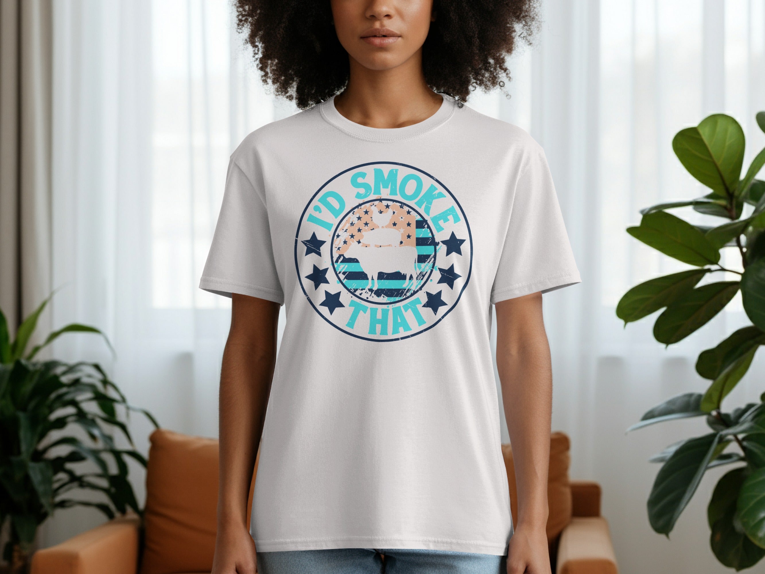 White t-shirt with a circular graphic that says "I'd Smoke That" with a pig and chicken.