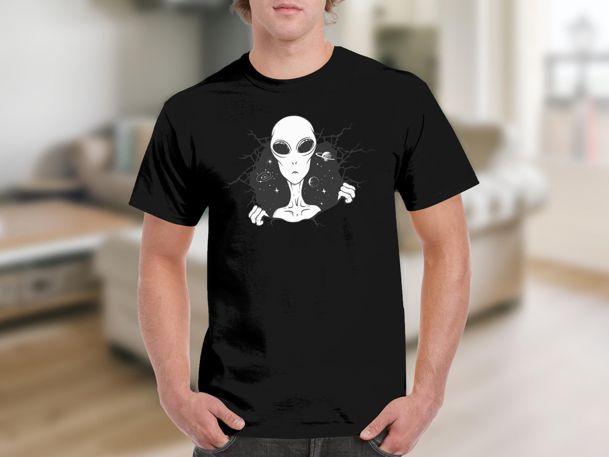 Black t-shirt featuring a white alien peeking through a cracked space background.