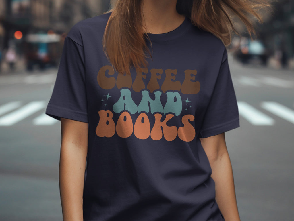 Navy t-shirt with retro "Coffee And Books" text in brown, teal, and orange.