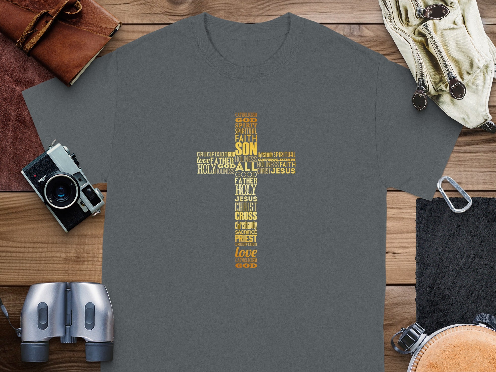 Dark grey t-shirt with religious word cloud forming a cross.