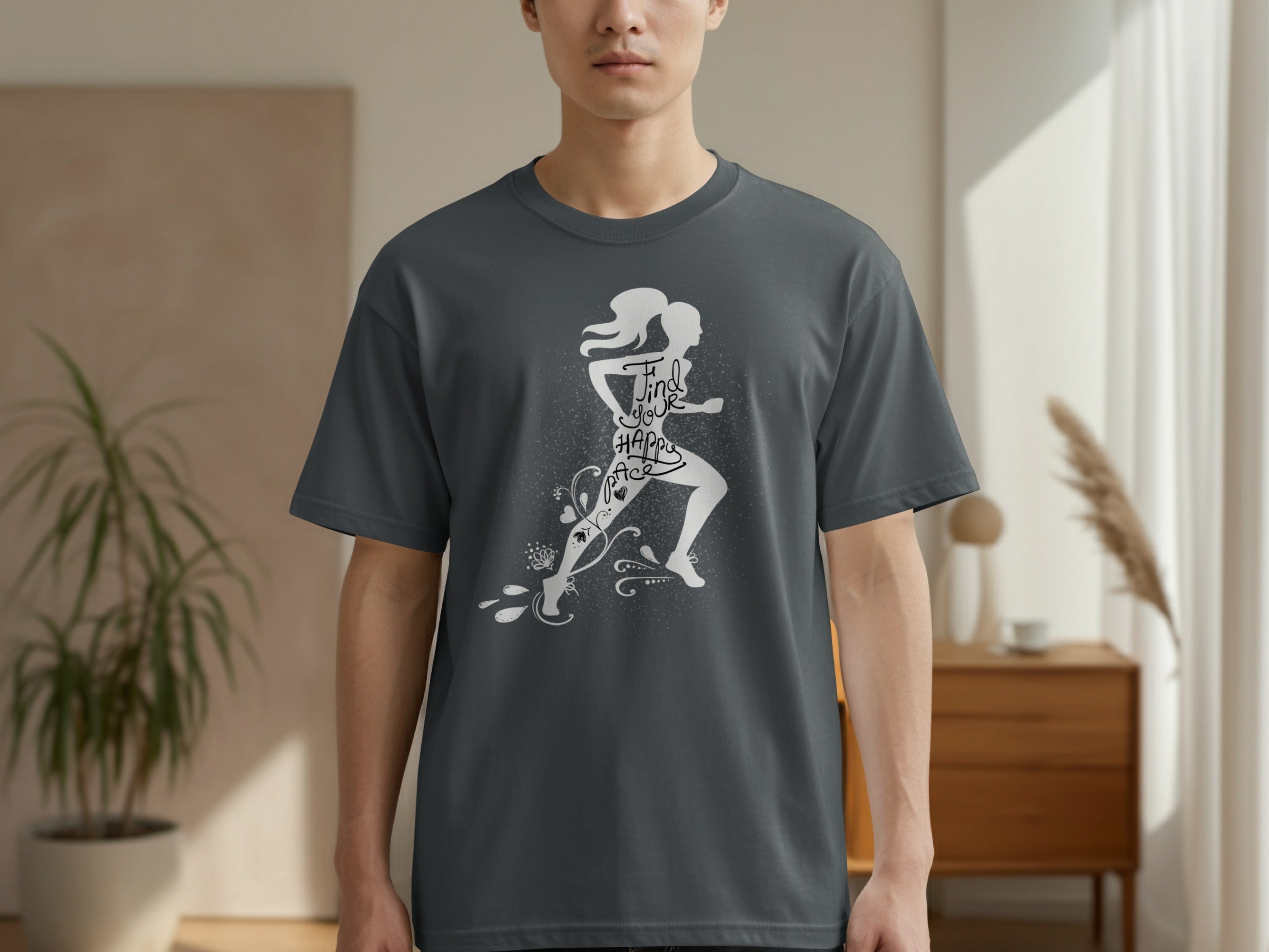 Dark grey t-shirt with white graphic of a runner and text "Find your happy pace".