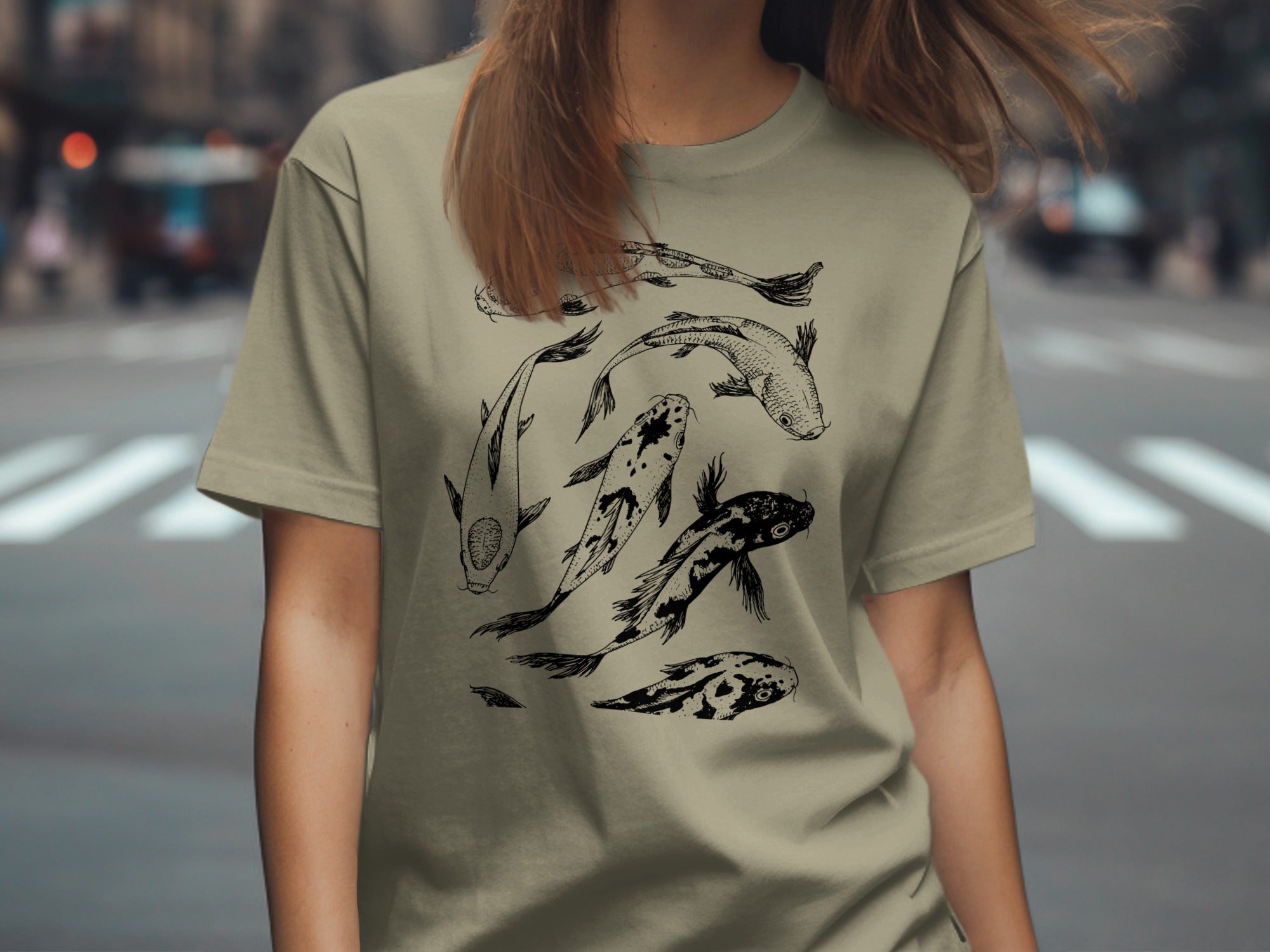 Tan t-shirt featuring a detailed black line drawing of koi fish.