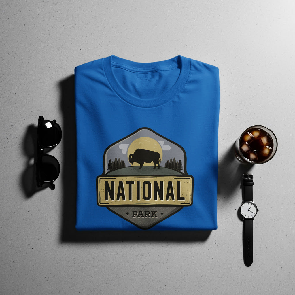 Blue t-shirt with a "National Park" logo featuring a bison on a hill with trees.