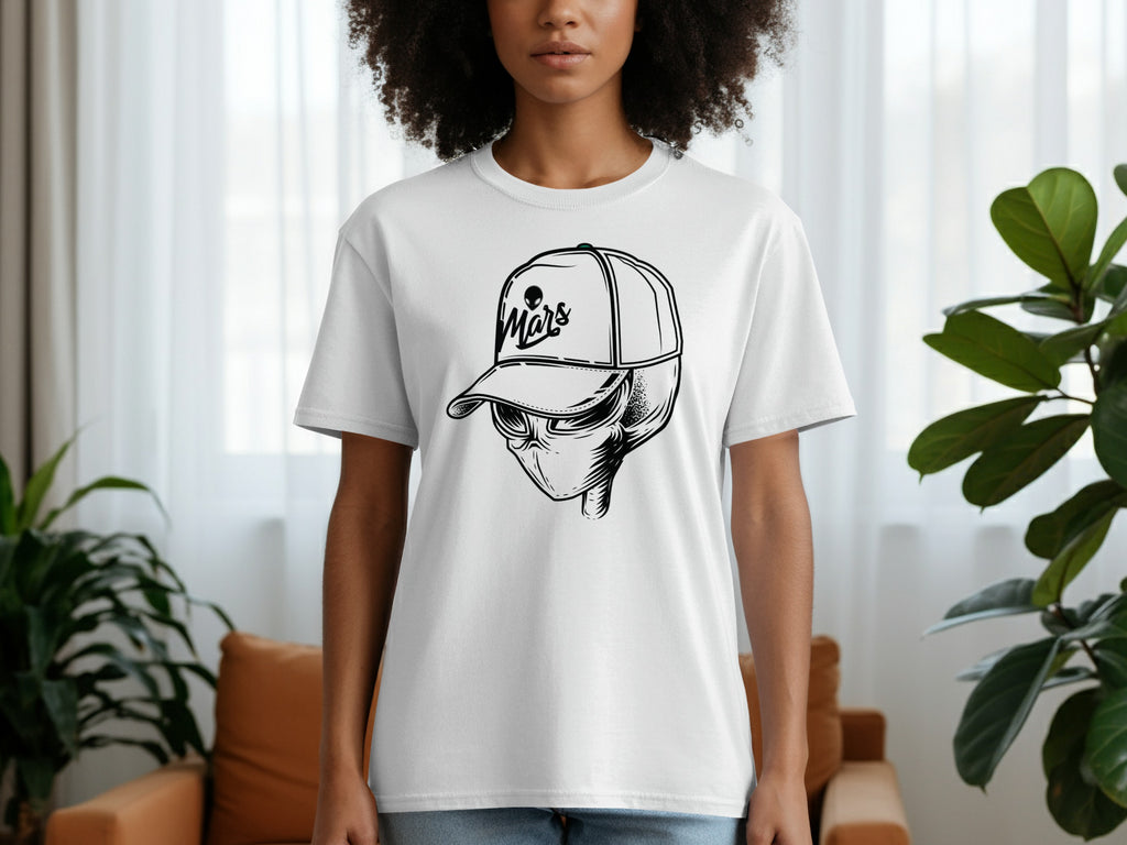 White t-shirt with a black alien head wearing a baseball cap with "Mars" text.