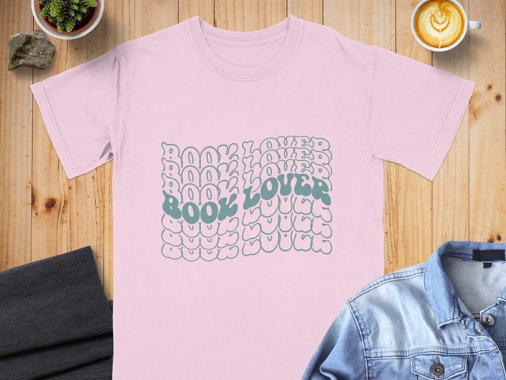 Pink t-shirt with stacked teal text reading "Book Lover".