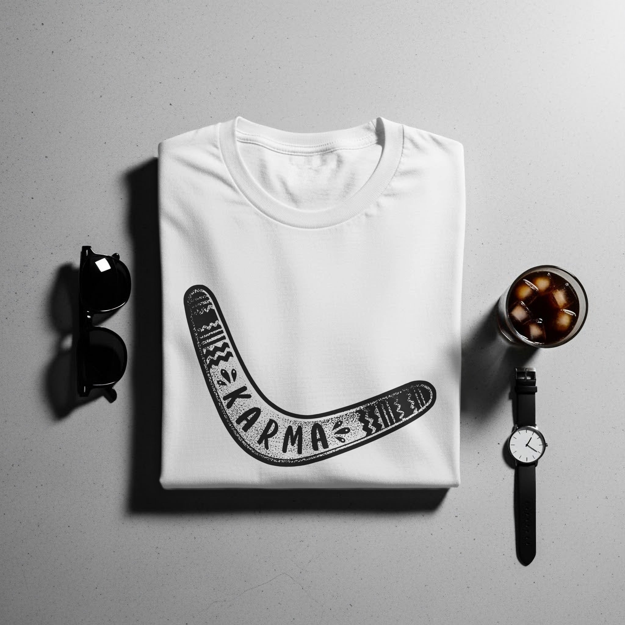 White t-shirt with a black boomerang graphic and the word "karma".