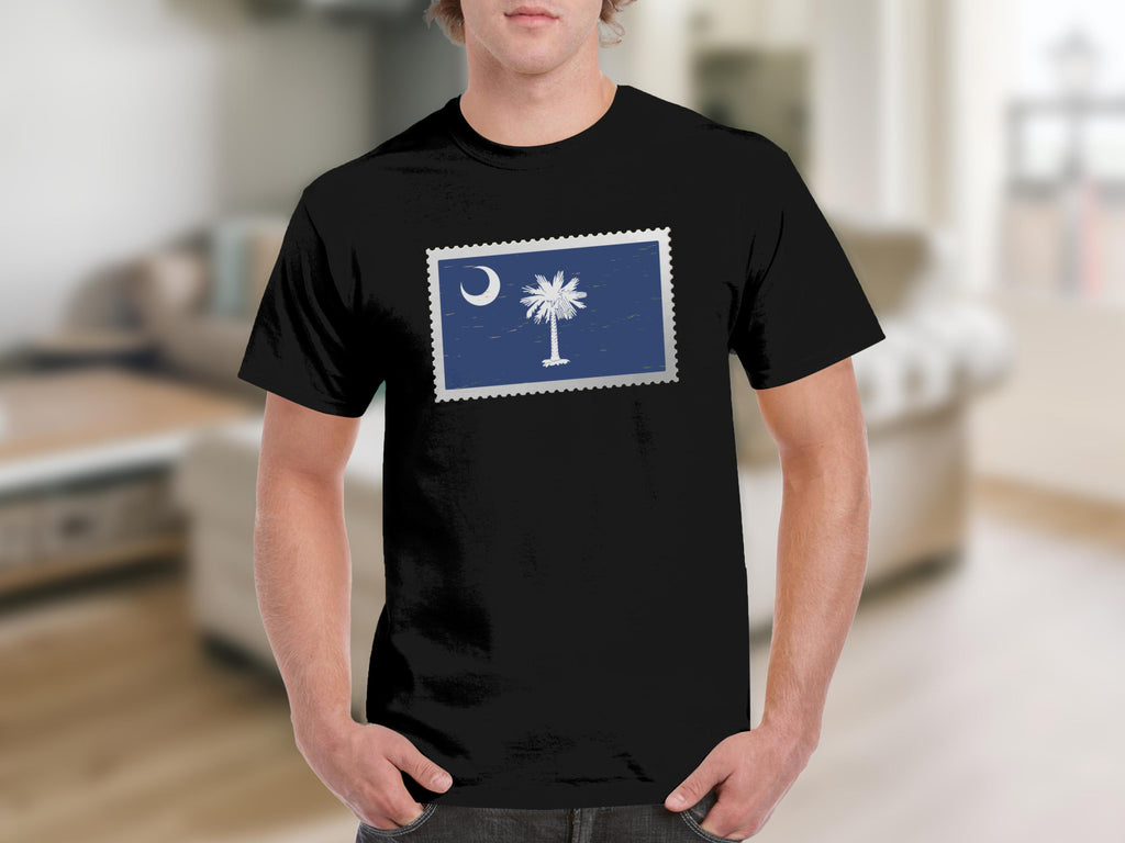Black t-shirt with a postage stamp graphic of the South Carolina flag.