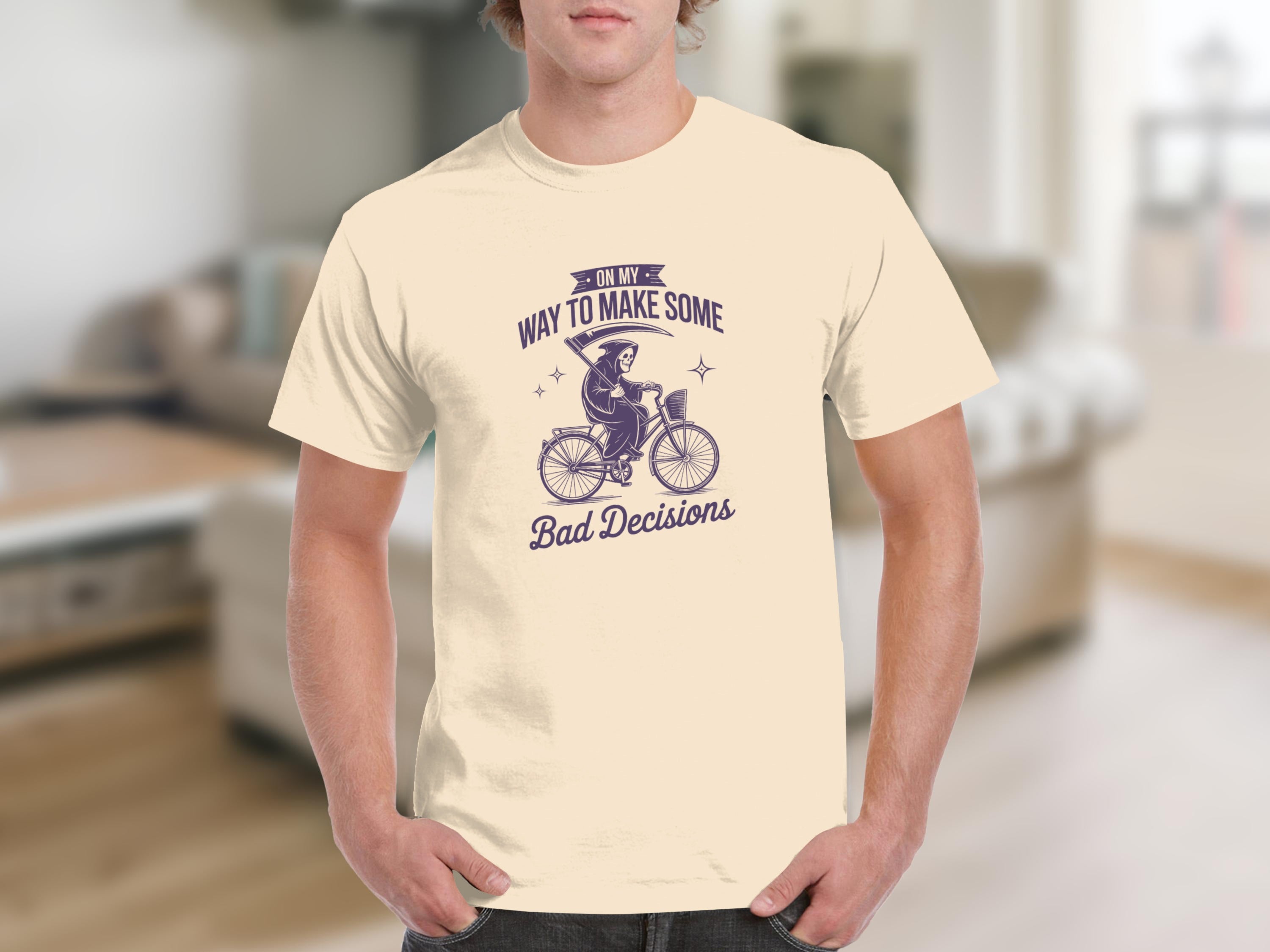 Cream t-shirt with Grim Reaper on bike graphic and text "ON MY WAY TO MAKE SOME Bad Decisions".
