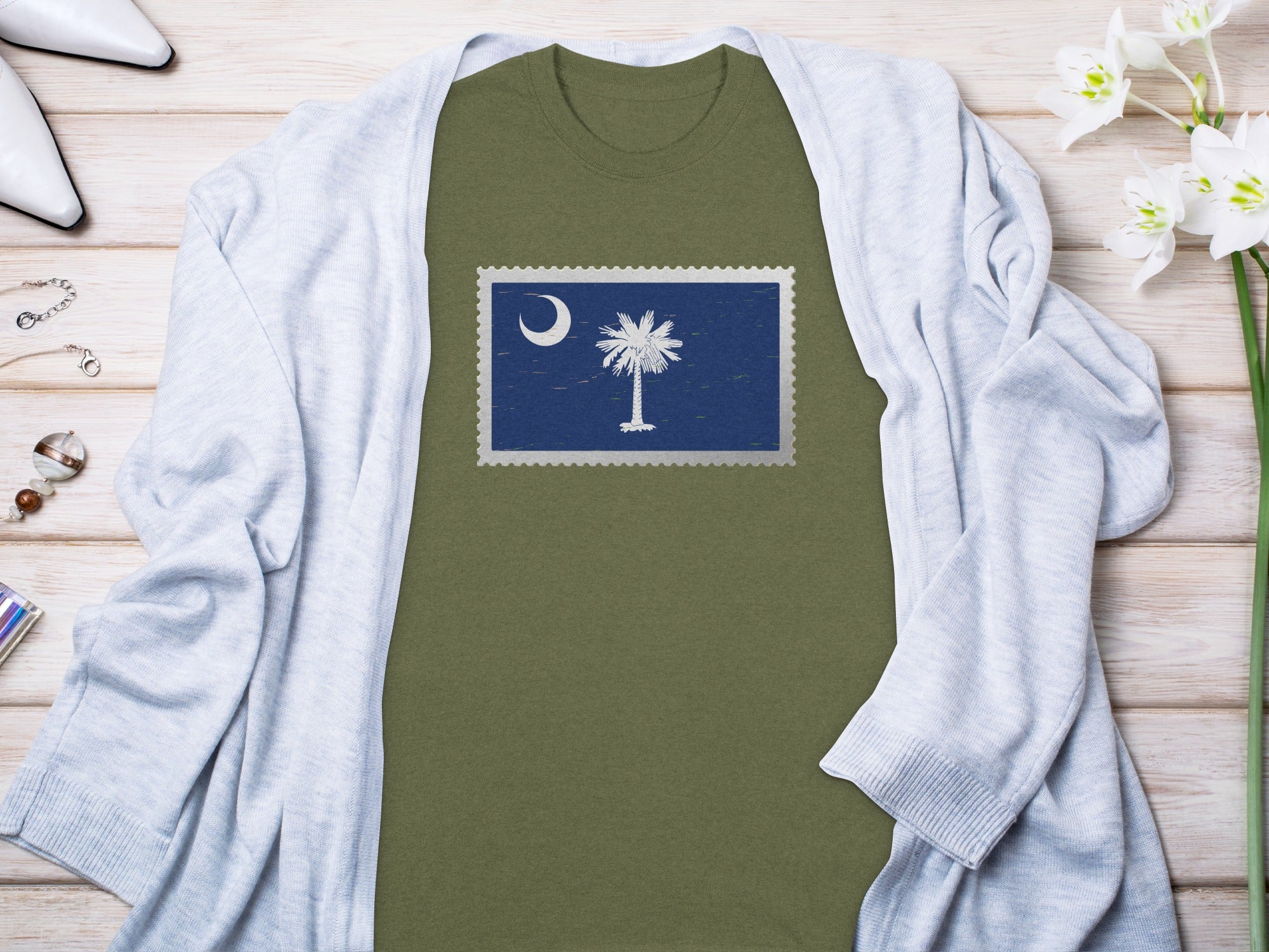 Olive green t-shirt with a South Carolina flag stamp graphic.