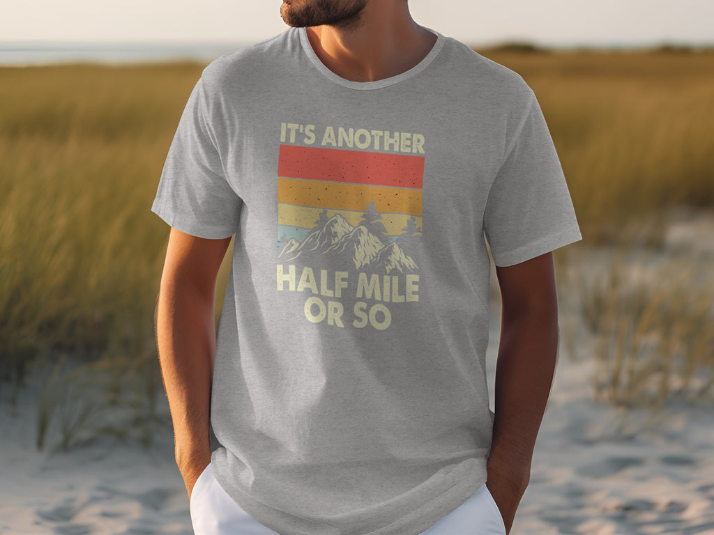 Gray t-shirt with vintage mountain graphic and text "IT'S ANOTHER HALF MILE OR SO."