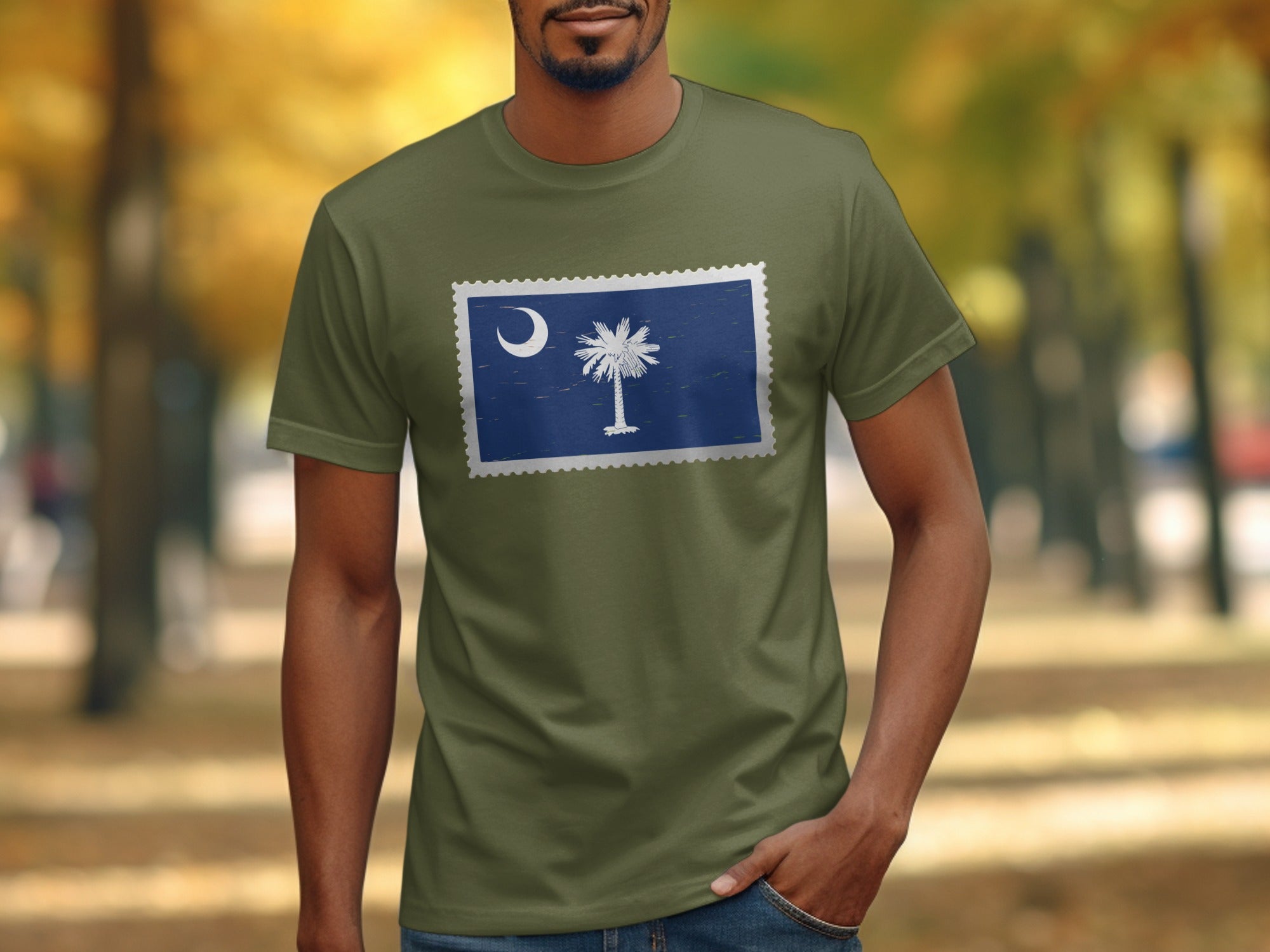 Man wearing olive green t-shirt with South Carolina flag stamp design.