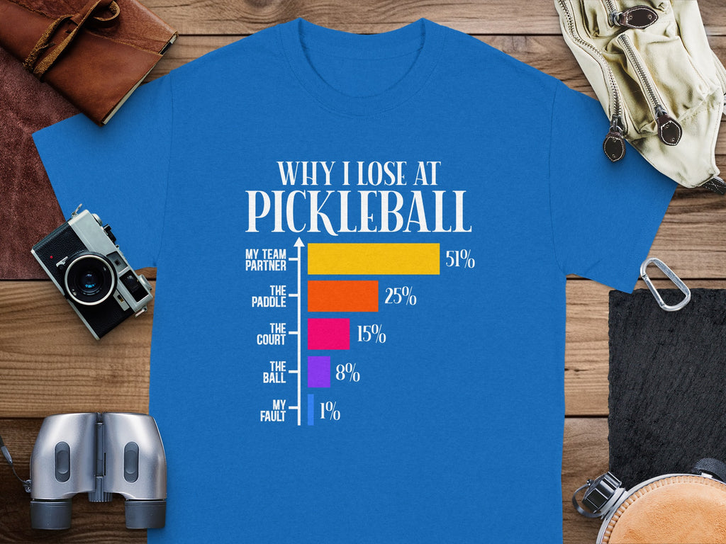 Blue t-shirt with "Why I Lose at Pickleball" graphic and bar chart.