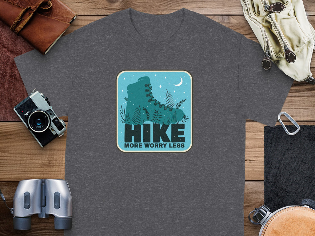Dark gray t-shirt with a graphic of a hiking boot, foliage, and moon.