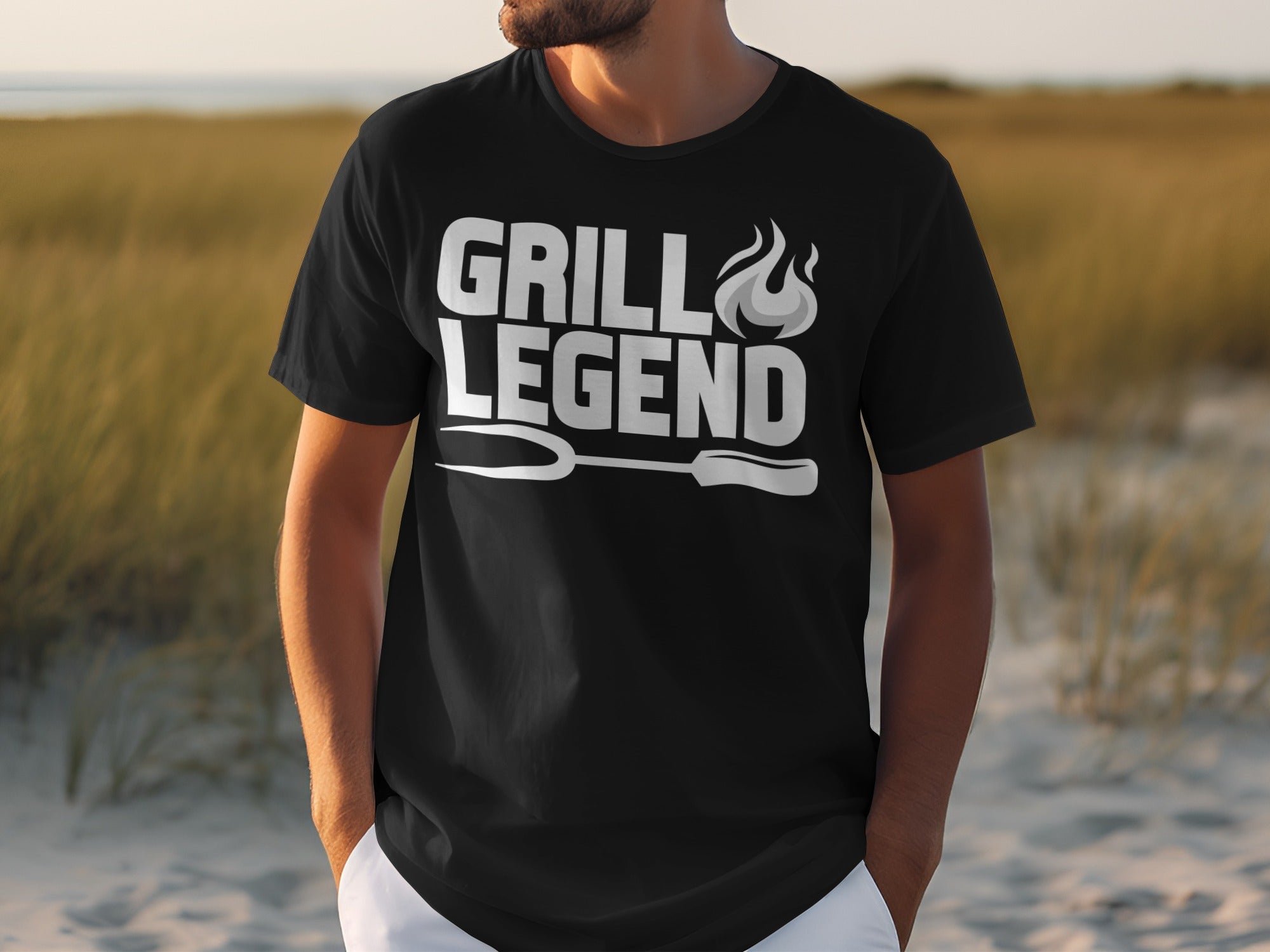Black t-shirt with white text "GRILL LEGEND" and grilling utensil graphic.