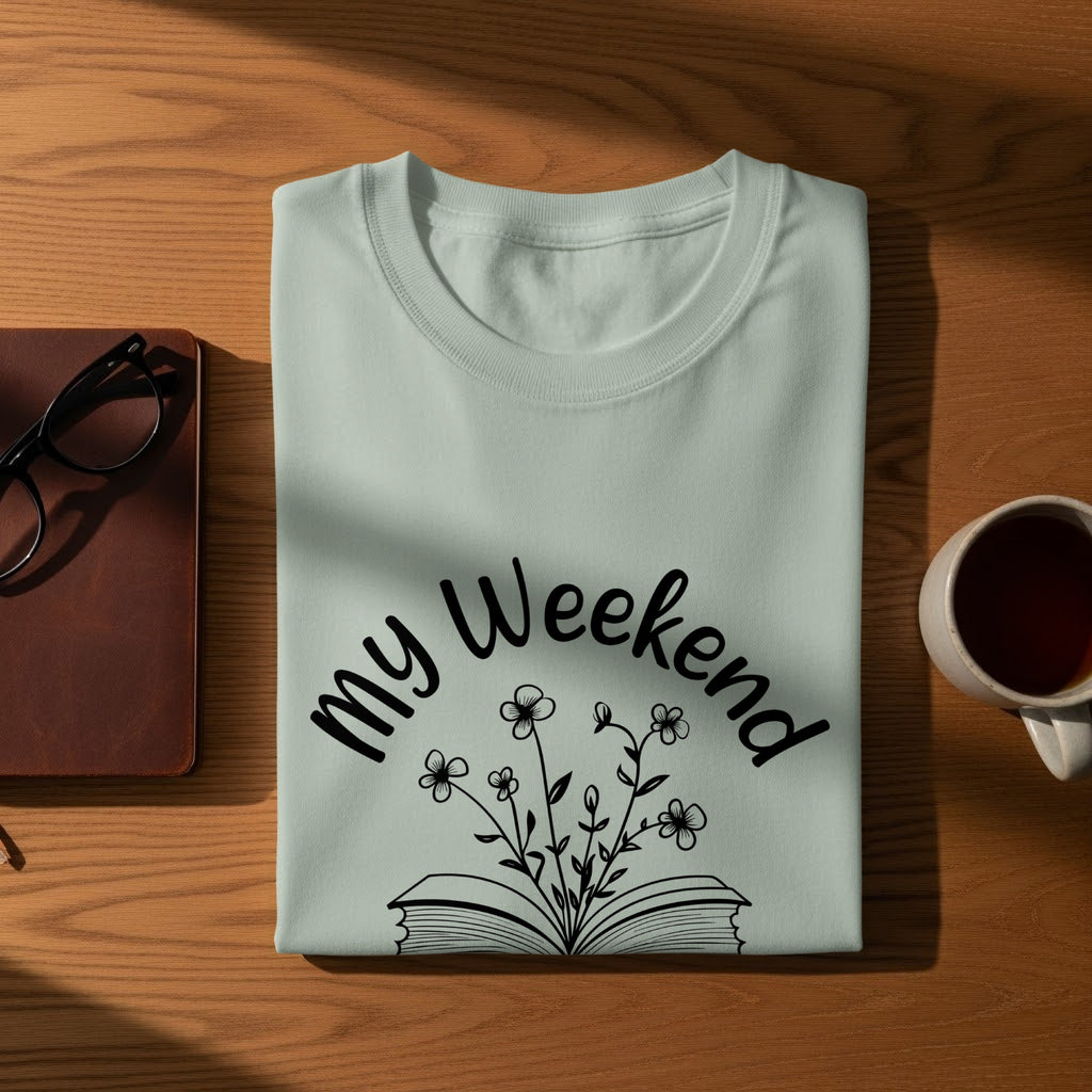Light blue t-shirt with "my Weekend" text and floral book design.