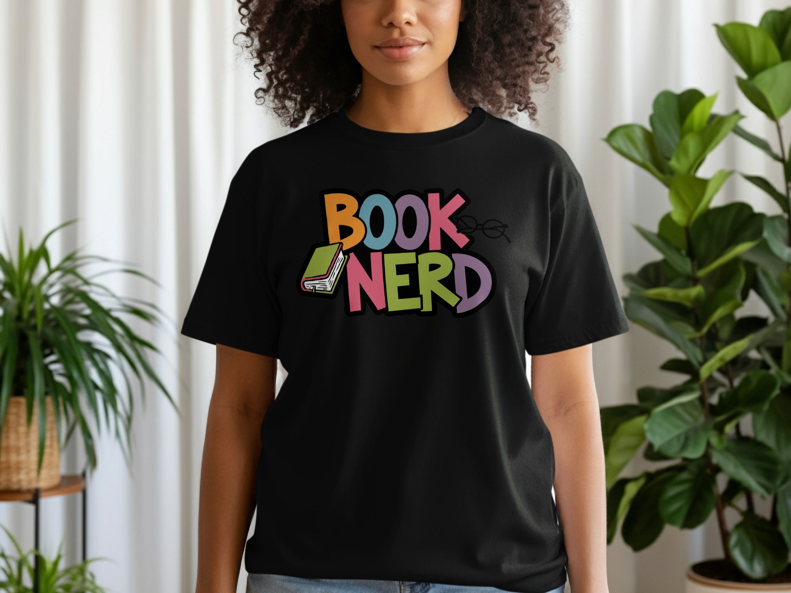 Black t-shirt with "BOOK NERD" text and book graphic.