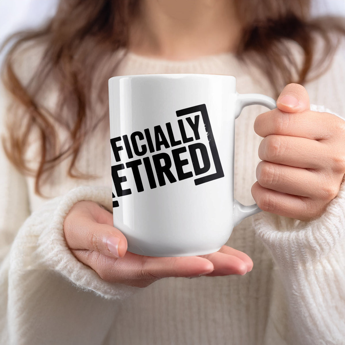 White mug with black text that reads "OFFICIALLY RETIRED"