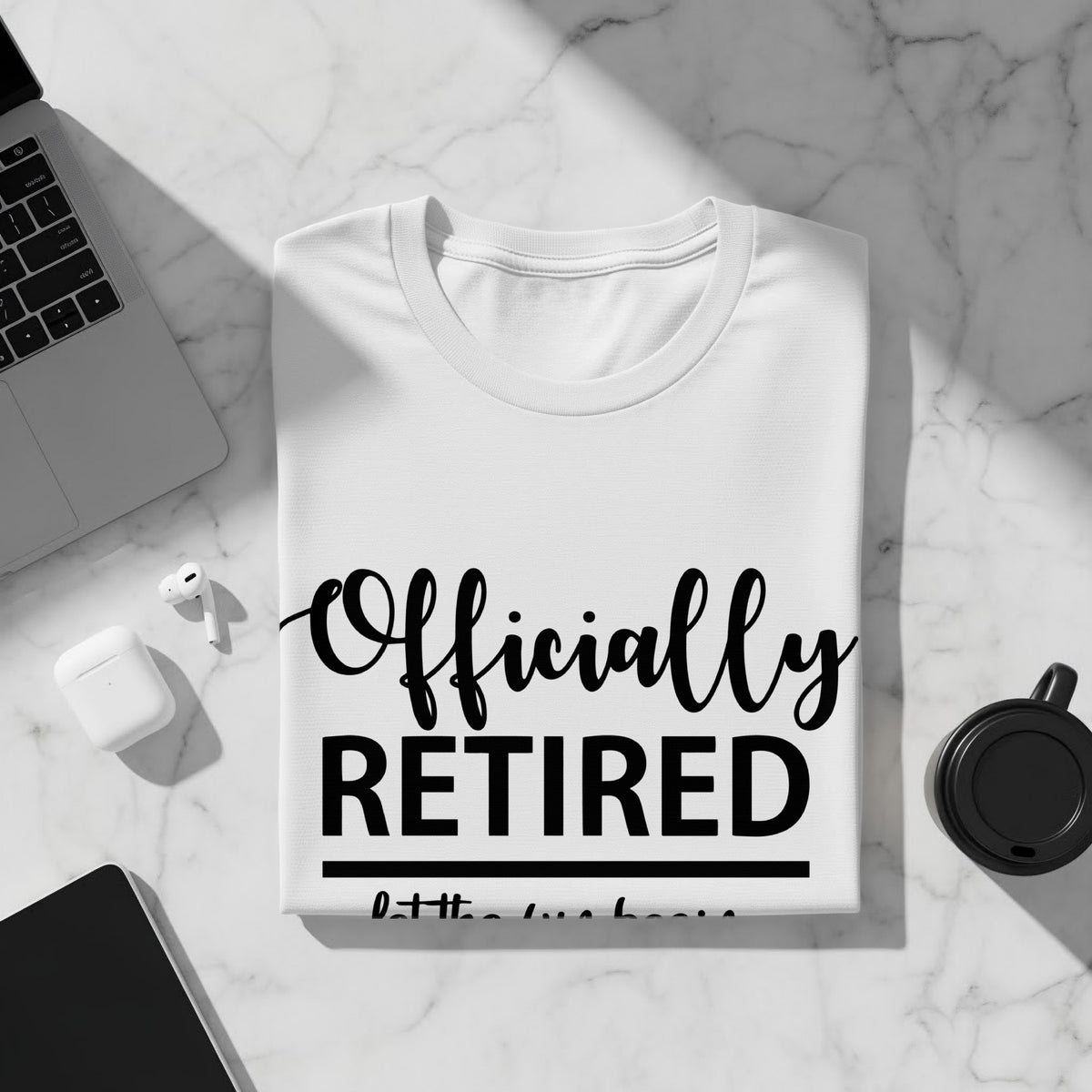 White t-shirt with black text reading "Officially RETIRED".