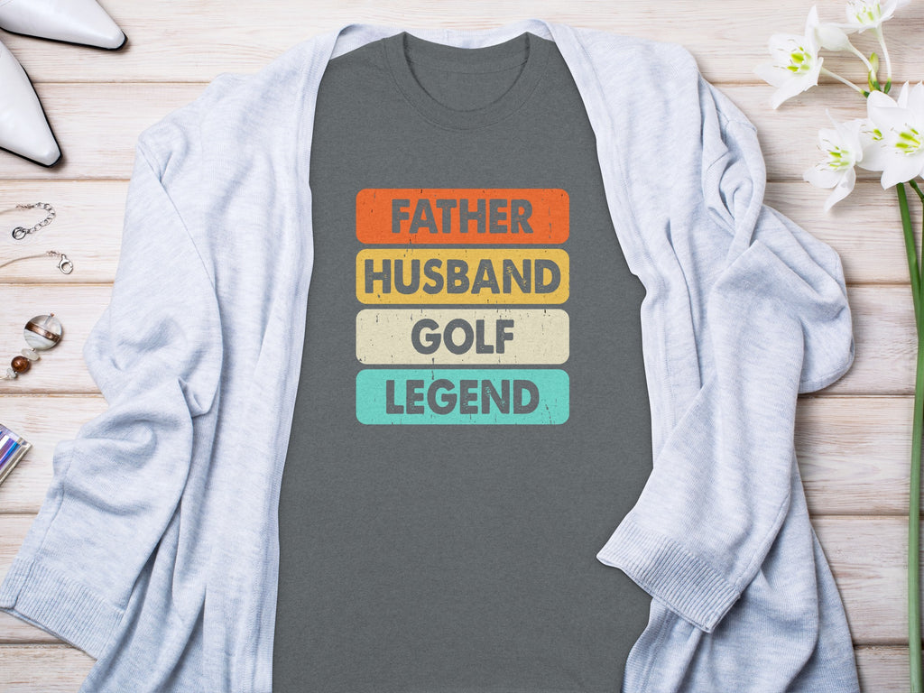 Gray t-shirt with "Father, Husband, Golf Legend" text in distressed colorful blocks.