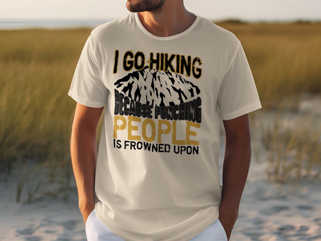 Cream t-shirt with text: "I GO HIKING BECAUSE PUNCHING PEOPLE IS FROWNED UPON."
