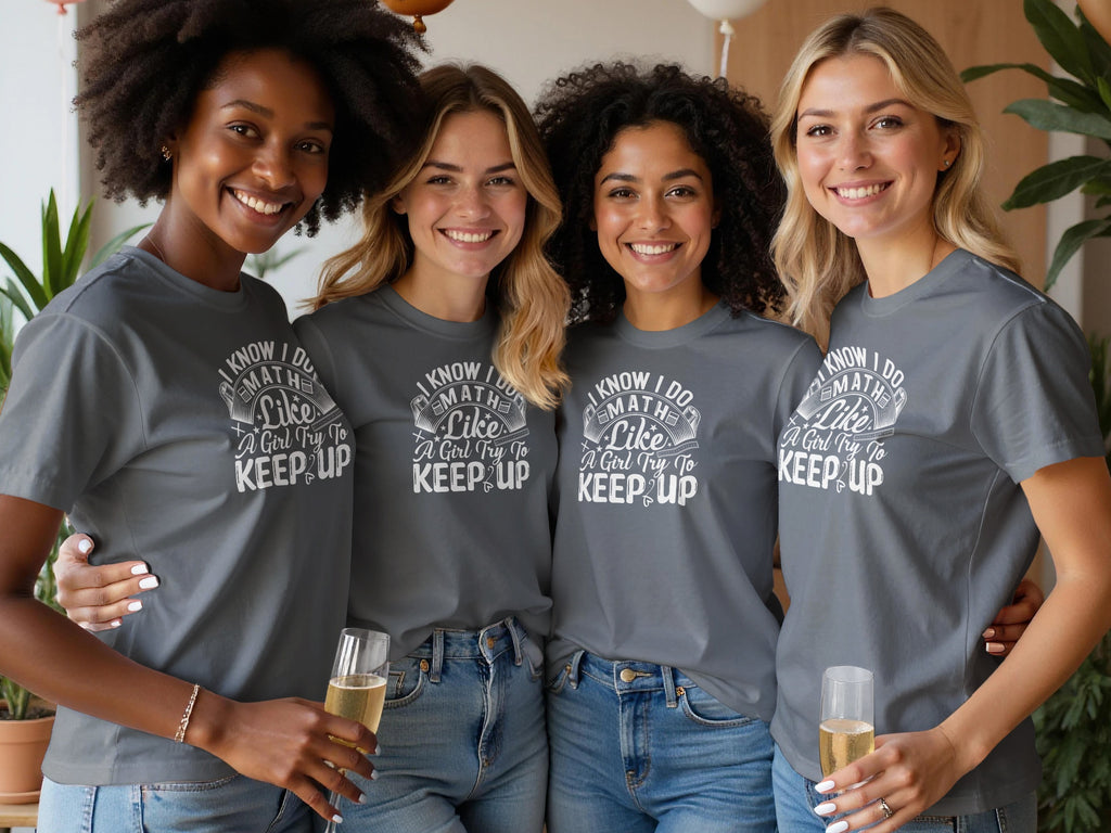 Four smiling women wearing graphic tees with "I Know I Do Math Like A Girl Try To Keep Up" text.
