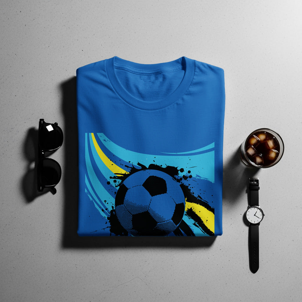 Blue t-shirt with abstract black and yellow soccer ball graphic.