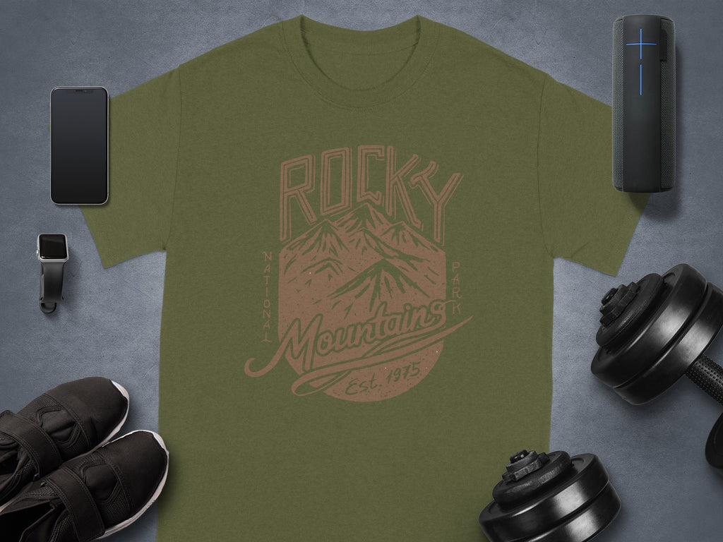 Olive t-shirt with "Rocky Mountains Est. 1975" text and mountain graphic.