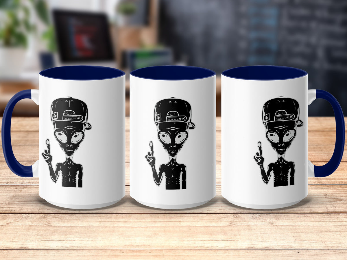 Three white mugs with blue interiors display black alien graphics with baseball caps.